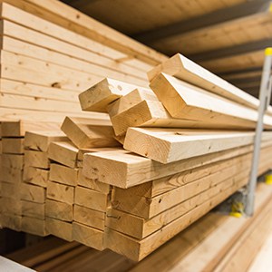 stacks of lumber in a large warehouse