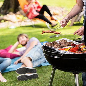 Barbecue on a grill with friends on a sunny afternoon