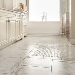 ceramic floor tile in multiple sizes laid across a large bathroom