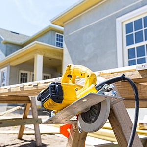 Tools are displayed at their work stations around the construction site of a new home.