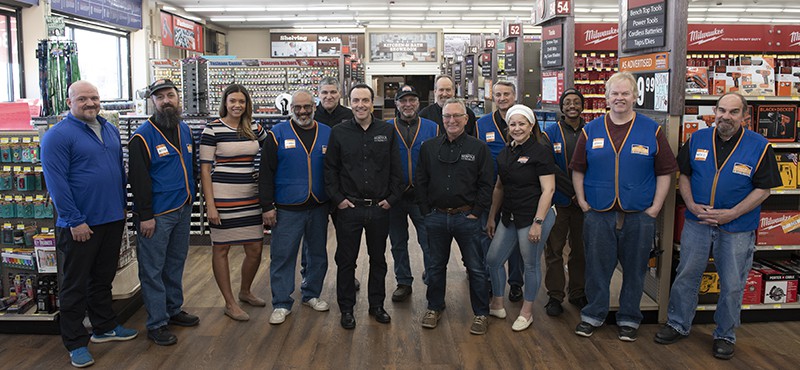 Norfolk hardware employees posing for a picture inside of the hardware store