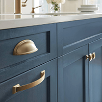 gold kitchen cabinet hardware on blue cabinets