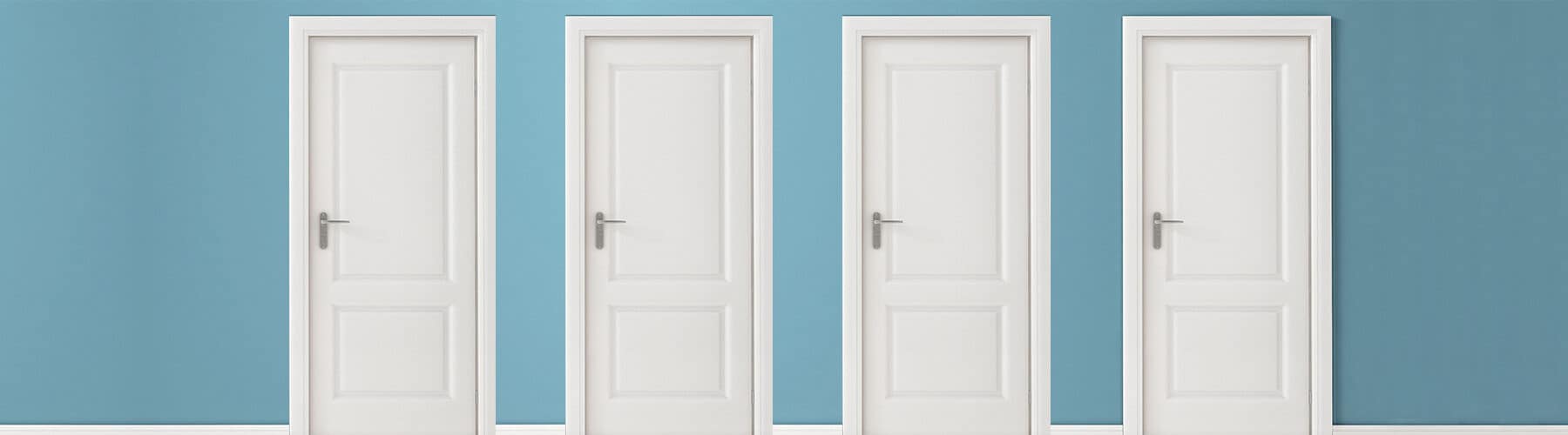 4 white interior doors on a blue wall