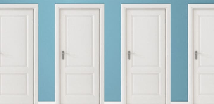 4 white interior doors on a blue wall