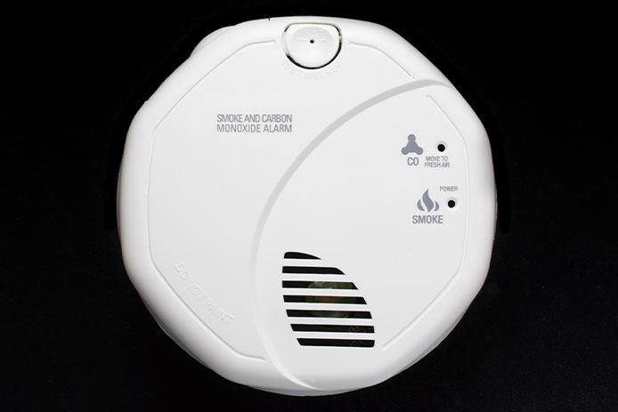 Smoke Alarm and Carbon Monoxide detector on black background